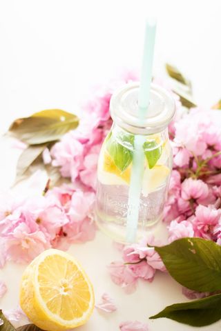 Refreshing lemon infused water with blossoms
