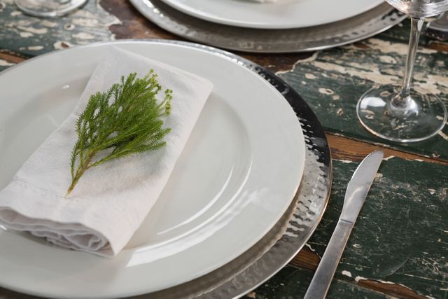Close-up of table setting on weathered wooden plank