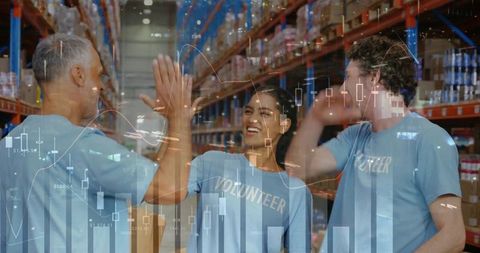 Warehouse Volunteers High-Fiving in Aisle with Inventory Charts Overlay Conveying Teamwork