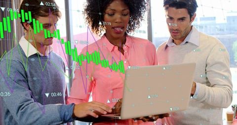 Business team analyzing market charts on laptop with real-time financial data overlay