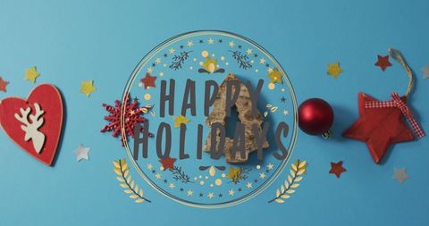 Festive blue holiday arrangement with happy holidays emblem