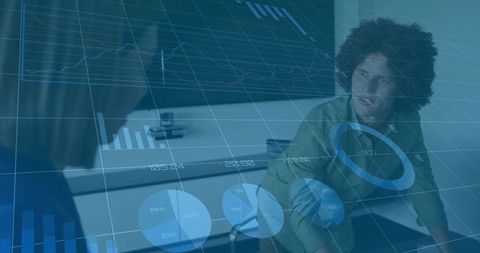Reviewing digital analytics overlays in collaborative boardroom meeting with diverse team