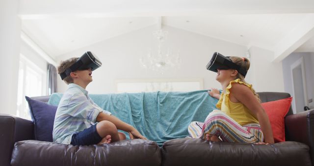 Children Playing Virtual Reality Games on Sofa in Bright Living Room - Download Free Stock Images Pikwizard.com