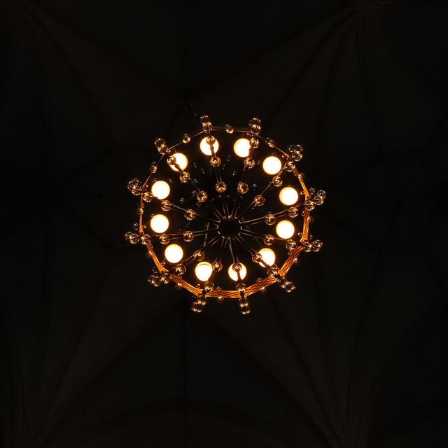 Bottom View of Illuminated Chandelier in Dark Room - Download Free Stock Photos Pikwizard.com