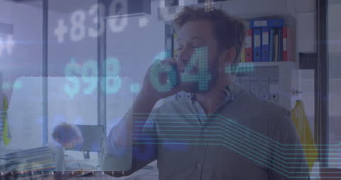 Financial Analyst Talking on Smartphone During Data Processing