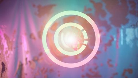 Abstract glowing concentric rings on colorful gradient