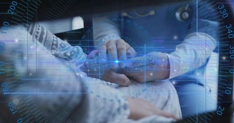 Futuristic doctor hands on patient abdomen with blue hud overlay for digital healthcare