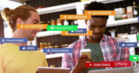 Two Casual Young Men Engaging with Social Media Notifications