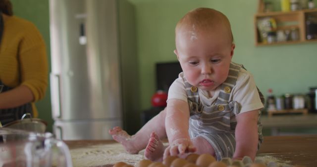 Adorable Baby Playing with Eggs on Kitchen Counter - Download Free Stock Images Pikwizard.com