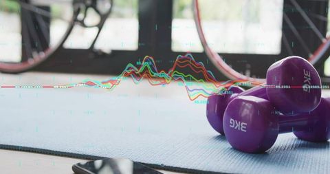 Home gym setup with dumbbells and modern technology