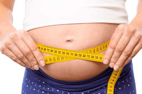 Transparent view pregnant woman measuring her bump with tape