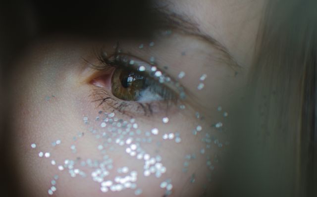 Close-up of Eye with Glitter on Skin - Download Free Stock Photos Pikwizard.com