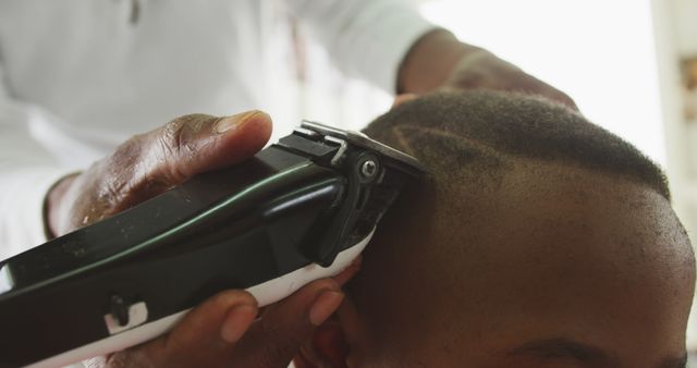 Barber Shaving Young Man's Head with Clippers Close-Up - Download Free Stock Images Pikwizard.com