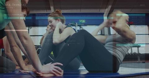 Group fitness performing partner crunches with digital code overlay for tech-fit concepts