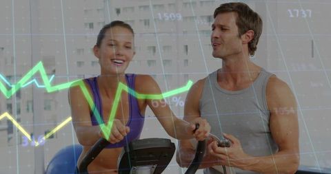Pedaling Couple Training on Stationary Bikes Monitoring Real-Time Fitness Metrics Overlay