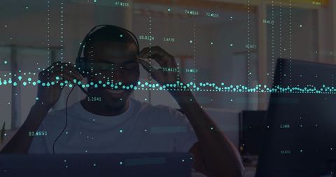 Man Analyzing Data on Laptop with Floating Visual Elements