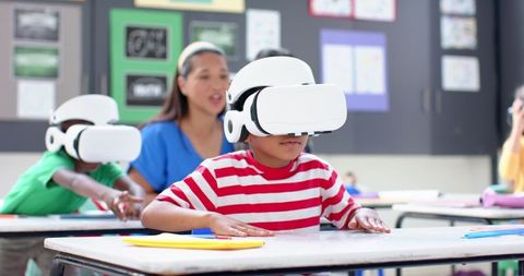 Children using vr headsets for interactive classroom learning