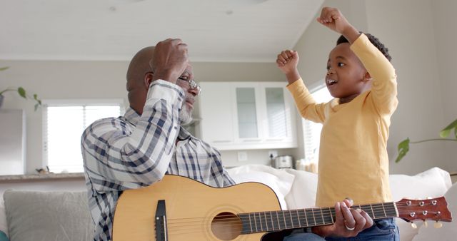 Grandfather Teaching Grandson Guitar Lessons at Home - Download Free Stock Images Pikwizard.com