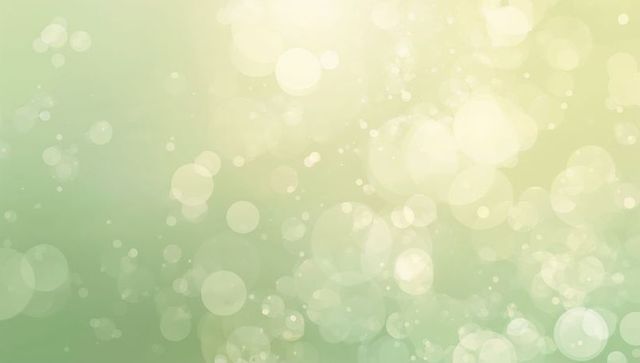Soft green bokeh background with dreamy sunlit circles and ambient glow