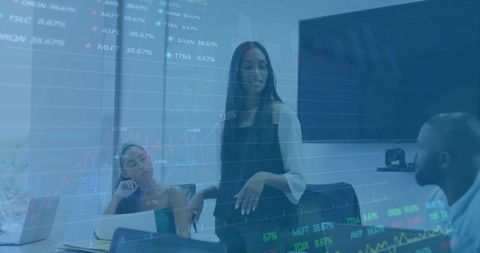 Businesswoman analyzing stock market data in office meeting