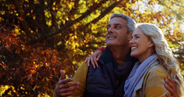 Happy Senior Couple Enjoying Autumn Nature Walk Together - Download Free Stock Photos Pikwizard.com