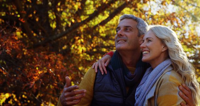 Happy Senior Couple Enjoying Autumn Nature Walk Together - Download Free Stock Images Pikwizard.com