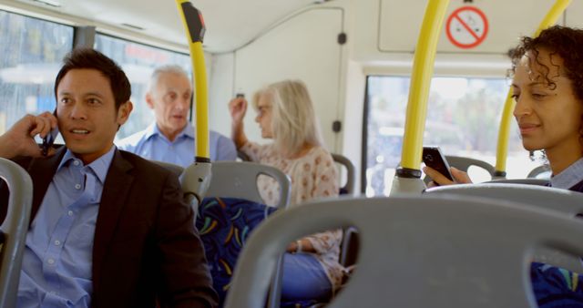 Diverse people sitting in city bus using smartphones. Communication, transport, city living and lifestyle, unaltered.