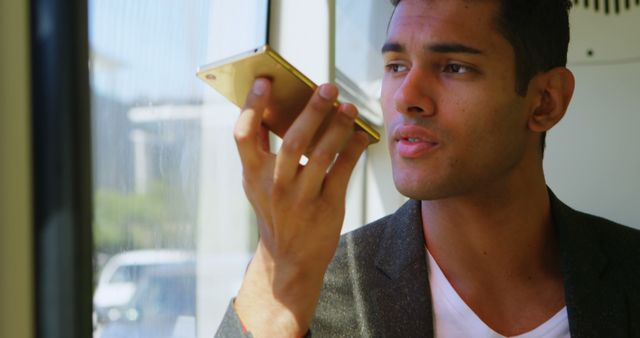 Man Using Voice Command on Smartphone in Bright Room - Download Free Stock Images Pikwizard.com