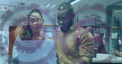 Young Business Professionals Strategizing with Futuristic Interface