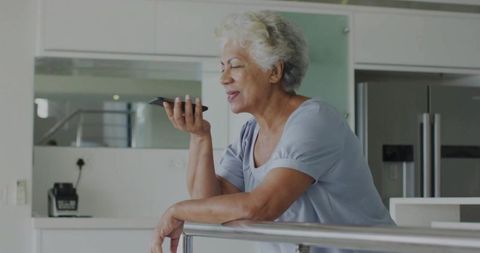 Senior Woman Professionals Using Smartphone for Conversational Technology