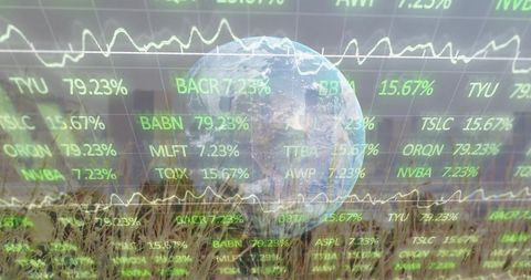 Earth globe floating over wheat field with green financial tickers and sustainability data
