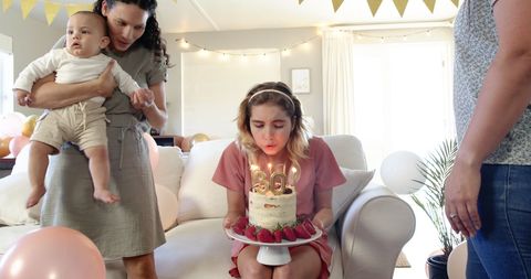 Joyful Birthday Celebration with Friends and Family in Cozy Living Room