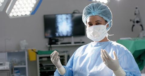 Surgeon Preparing for Surgery in Advanced Operating Room