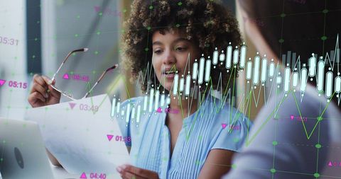 Businesswoman Analyzing Financial Data with Colleague