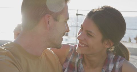 Couple Enjoying Romantic Beach Day with Sunlight Glow