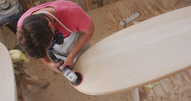 Craftsman Sanding Wooden Surfboard in Workshop - Download Free Stock Images Pikwizard.com