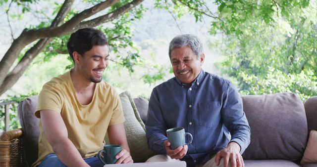 Father and Son Enjoying Coffee Together on Patio - Download Free Stock Images Pikwizard.com