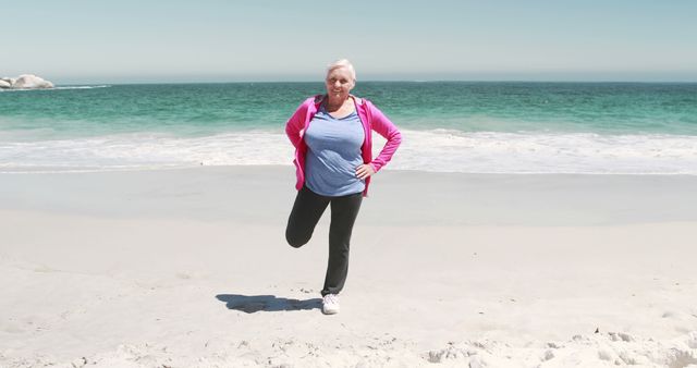 Senior Woman Exercising on Ocean Beach for Healthy Lifestyle - Download Free Stock Images Pikwizard.com