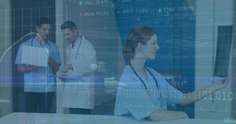 Clinician examining x-ray with colleagues in modern medical setting