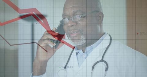 Senior doctor using phone with declining red graph overlay telemedicine finance warning