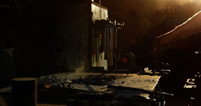 Blacksmith Hand Crafting Metal in Dimly Lit Forge - Download Free Stock Images Pikwizard.com