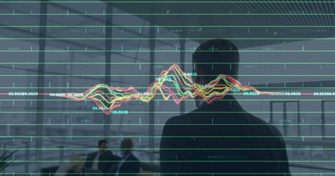 Business Leader Analyzing Data in Modern Office Environment