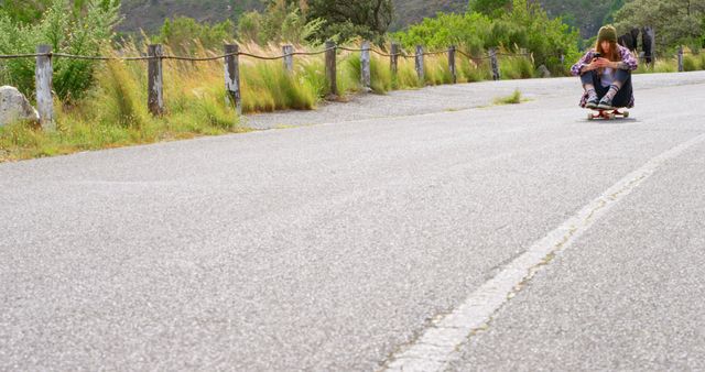 Teen Enjoying Skateboarding Ride on Remote Country Road - Download Free Stock Images Pikwizard.com