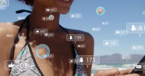 Woman on Beach Receiving Social Media Alerts in Background