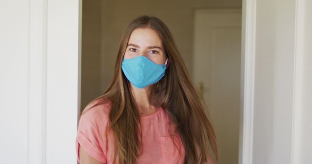 Smiling Young Woman Wearing Face Mask Indoors - Download Free Stock Images Pikwizard.com