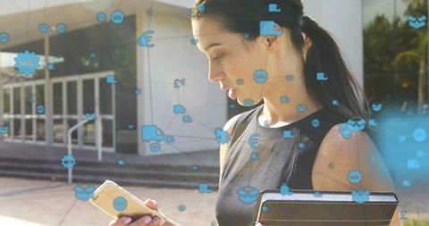 Businesswoman engaging with digital communication icons outdoors