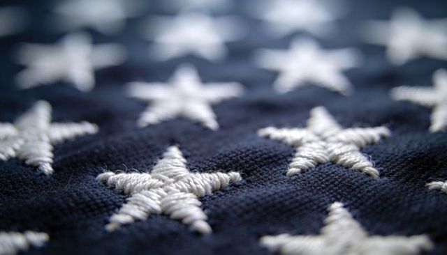 Macro Embroidered White Stars on Navy Fabric Textile Flag Stitch Detail and Thread Texture
