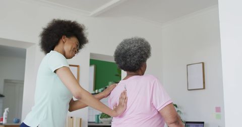 Physical Therapy Session with Senior During Pandemic