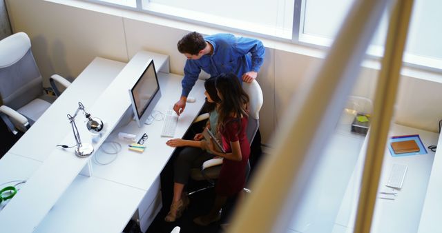 Colleagues Collaborating at Modern Office Desk from High Angle - Download Free Stock Images Pikwizard.com