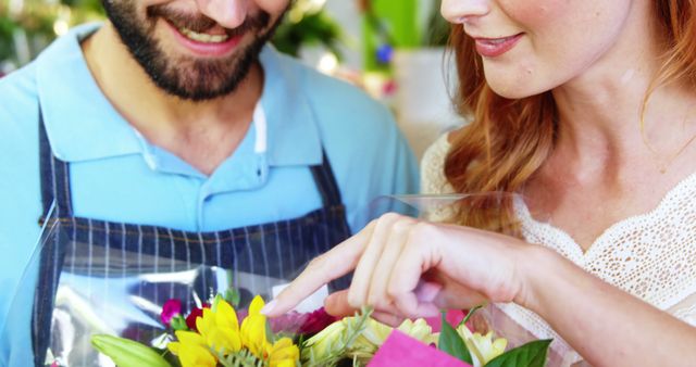 Young Florist Helping Customer With Bouquet Selection - Download Free Stock Images Pikwizard.com